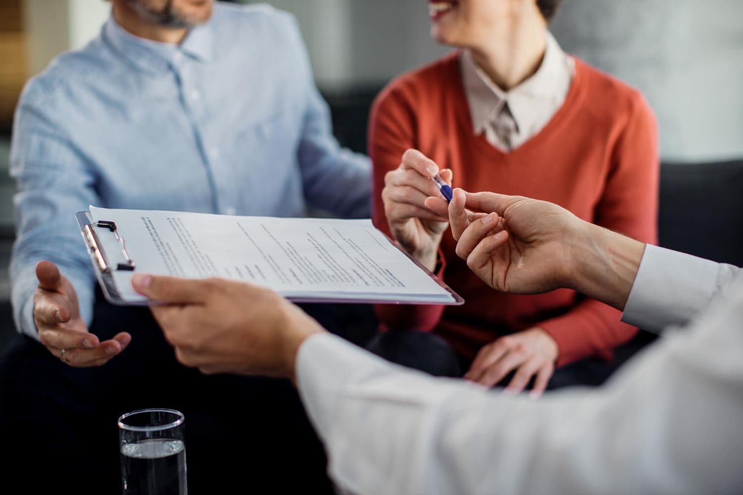 Public adjuster consulting with homeowners
